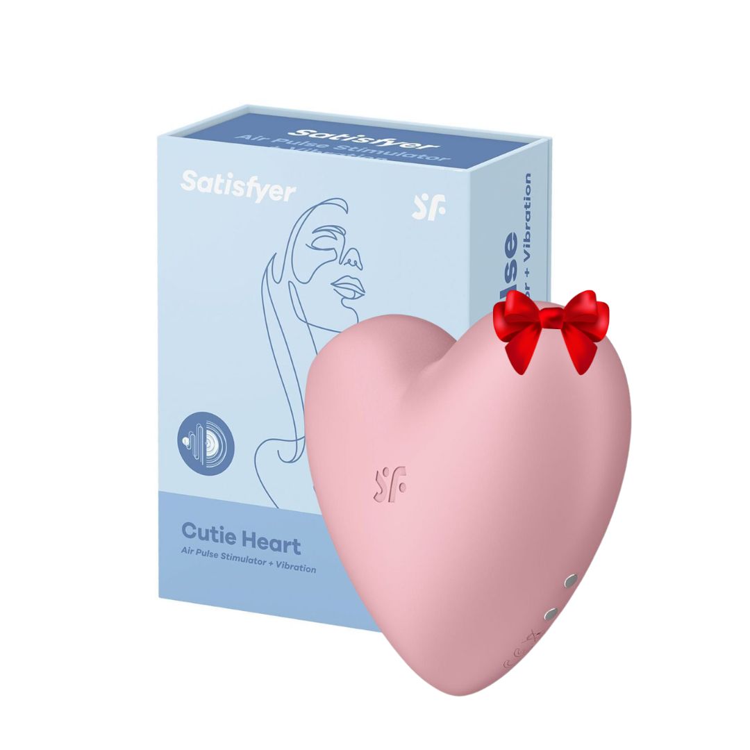 Vibratorius - klitorio stimuliatorius „Satisfyer Cutie Heart“, rožinis  
Toks mielas, kad gali pavogti jūsų širdį, taip sakoma apie „Cutie Heart“ stimuliatorių. 
Šis mielas, spalvingas ir žaismingos širdelės formos žaisliukas sukurtas malonumų ieškotojoms. Du galingi, atskirai valdomi varikliukai suteiks jums  11 skirtingo intensyvumo slėgio bangų bei 12 vibracijos nustatymų  - kurie iš viso  sudaro net  132 skirtingus malonumų derinius.  
Ergonomiškas  ir kompaktiškas ,,Cutie Heart" klitorio stimuliatorius puikiai tinka kelionėms: svaiginantis bangų ir vibracijos derinys suteiks jums kvapą gniaužiančią bekontaktę klitorio stimuliaciją. 
Kompaktiškos formos stimuliatorių lengva įsidėti į rankinę, o dėka įkraunamos ličio jonų baterijos jis bus visada paruošęs suteikti jums svaiginančią kulminaciją. 
Stimuliatorius yra  atsparus vandeniui  (IPX7), todėl malonumais galėsite mėgautis net duše ar vonioje.  Po vandeniu jo galinga bangų stimuliacija yra daug stipresnė. Jei žaislas išsikraus - bateriją galima įkrauti naudojant pridedamą USB laidą. 
Tinkamai prižiūrint šis stimuliatorius tarnaus jums ilgai. Prieš ir po kiekvieno naudojimo nuplaukite jį šiltu vandeniu ir švelniu muilu arba  specialiu žaislų valikliu . Leiskite išdžiūti natūraliai. Šį sekso žaislą laikykite stalčiuje, specialiame maišelyje arba kitoje vietoje, kurioje nėra dulkių. Laikykite jį atokiau nuo kitų sekso žaislų. Nepalikite tiesioginiuose saulės spinduliuose ir niekada nelaikykite jo dideliame karštyje. 
Rekomenduojama naudoti kartu su  vandens pagrindo lubrikantu . Nenaudokite silikoninių lubrikantų, aliejų ar kremų, nes jie gali sugadinti prietaiso medžiagą ir apriboti jo veikimą bei galiojimo laiką. 